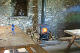 Cosy wood burner at Alstonefield Camping Barn